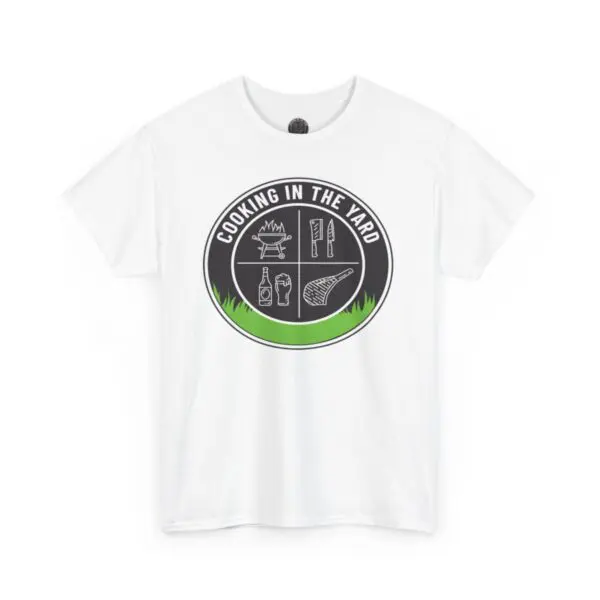 The Cooking In The Yard T-Shirt is a white tee adorned with a circular black logo and green accents. It includes images of a campfire, chef's knife, hot sauce bottle, spatula, and grill within the circle, making it an ideal choice to express your passion for delightful outdoor cooking experiences.