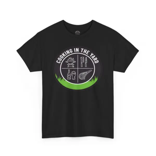 Ideal for any backyard barbecue, the Cooking In The Yard T-Shirt in black boasts a circular graphic that reads "Cooking in the Yard." The design highlights icons of a grill, knife, beer bottle, ketchup, and steak amidst grass. It's a great option for anyone who enjoys good vibes and delicious moments.