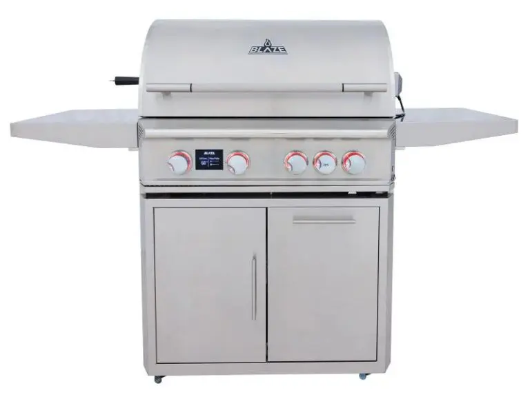 A stainless steel Blaze Grill outdoor gas grill with four control knobs, side shelves, double doors below, and a closed lid—designed for backyard cooking and barbecuing. Enter the Blaze Grill Giveaway for your chance to win this backyard essential!.
