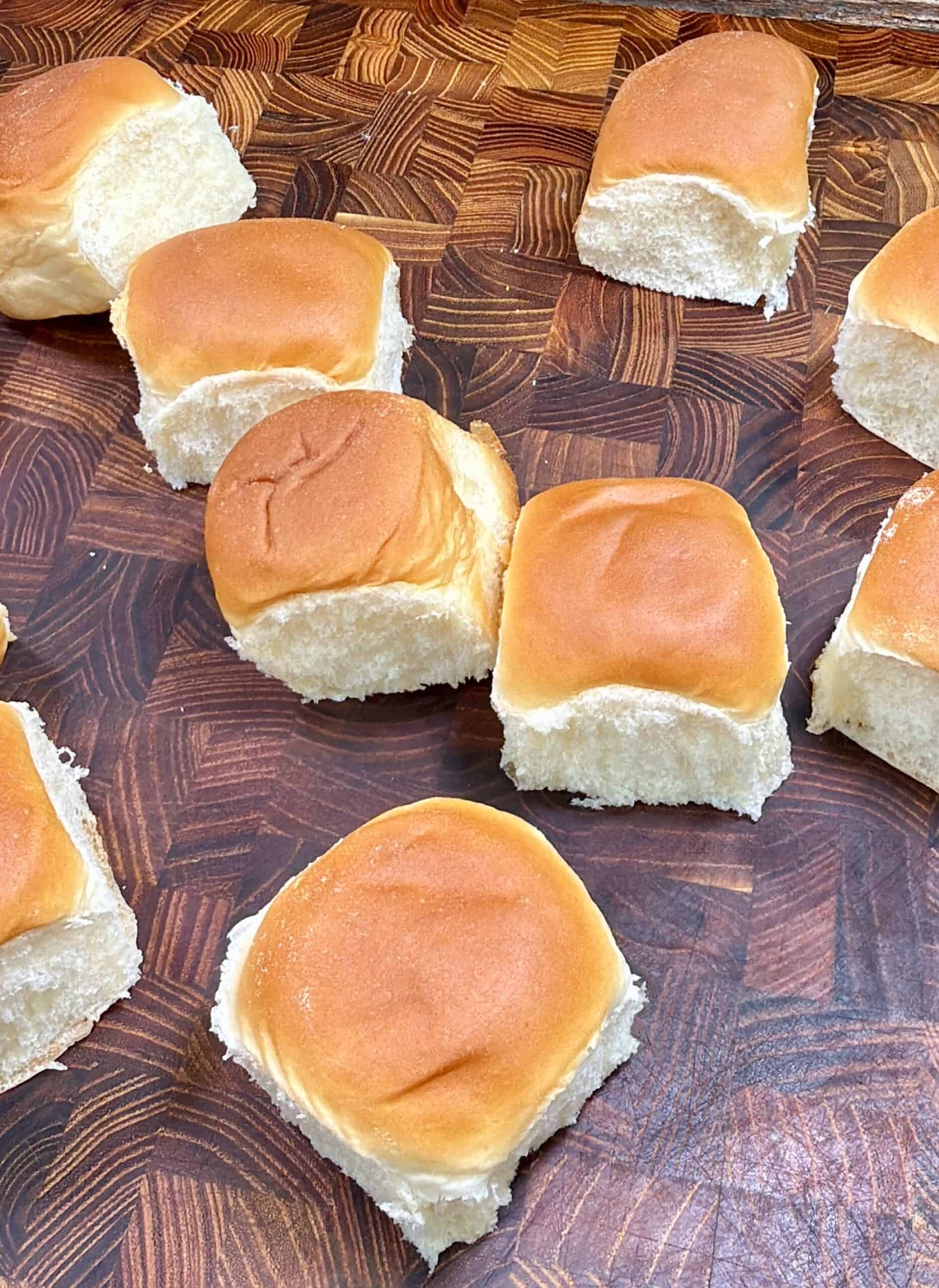 A group of rolls on a table.