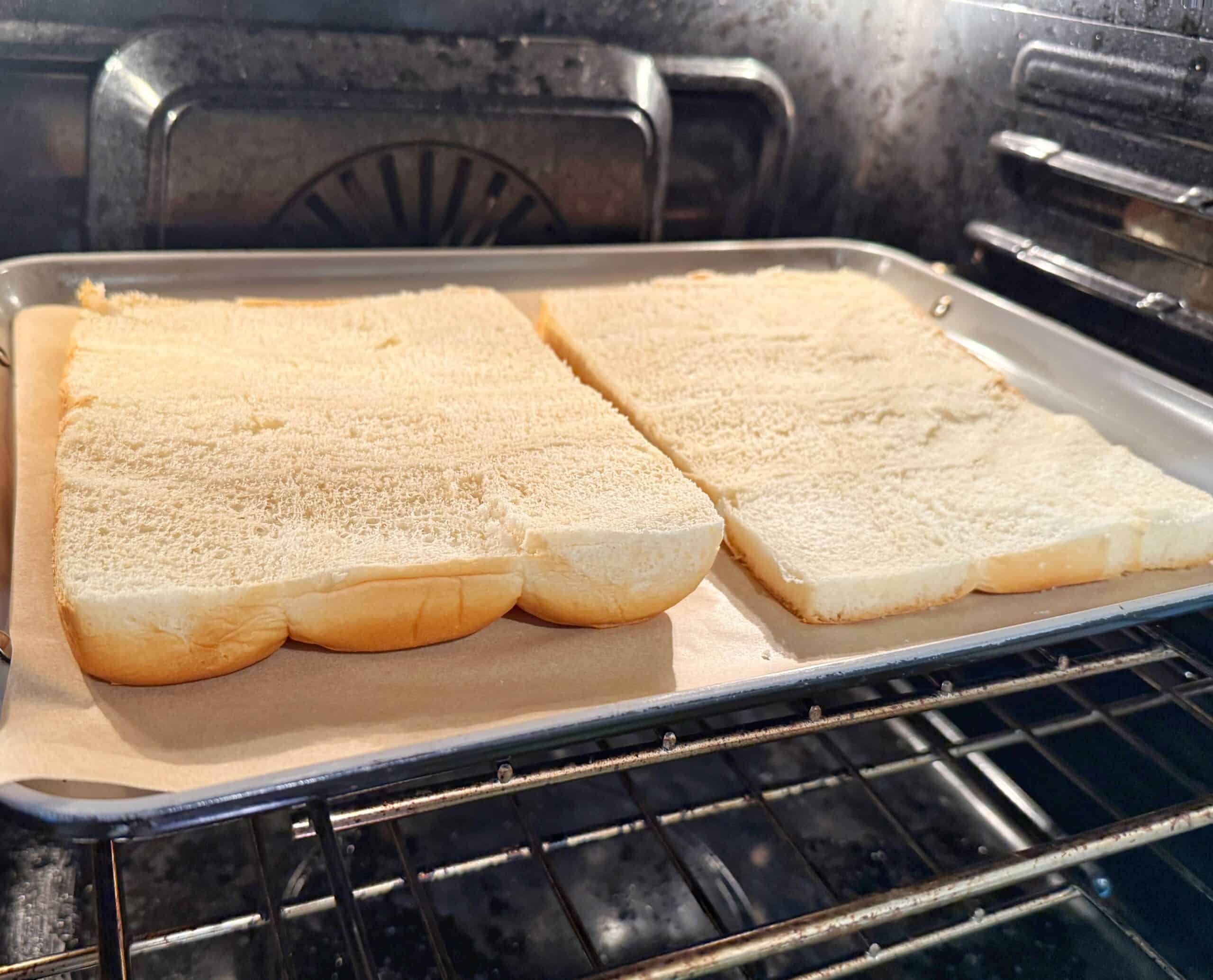 A tray of bread in an oven.
