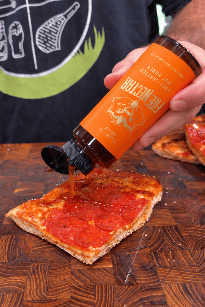 Upside-down sheet pan pizza being prepared.