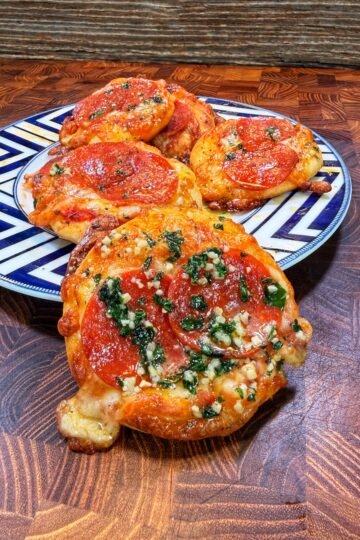 Mini pepperoni pizzas being prepared