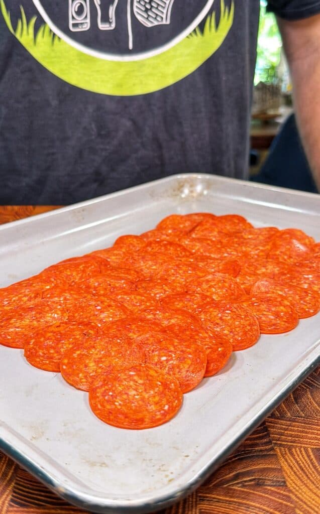 Upside-down sheet pan pizza being prepared.