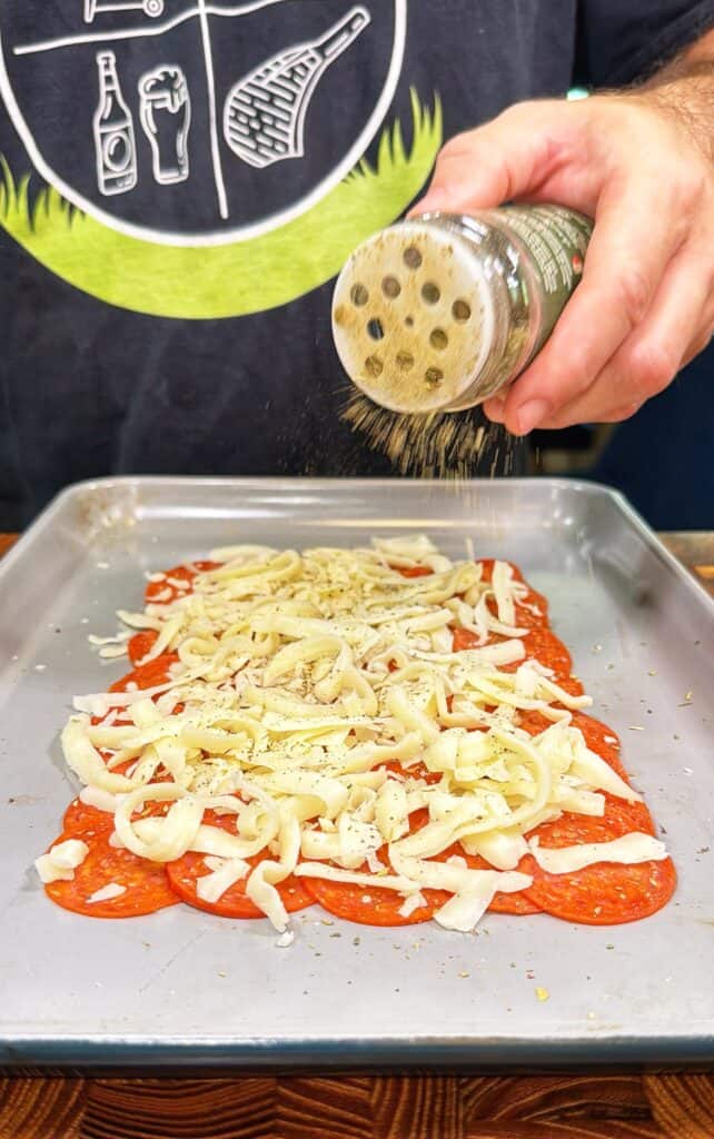 Upside-down sheet pan pizza being prepared.