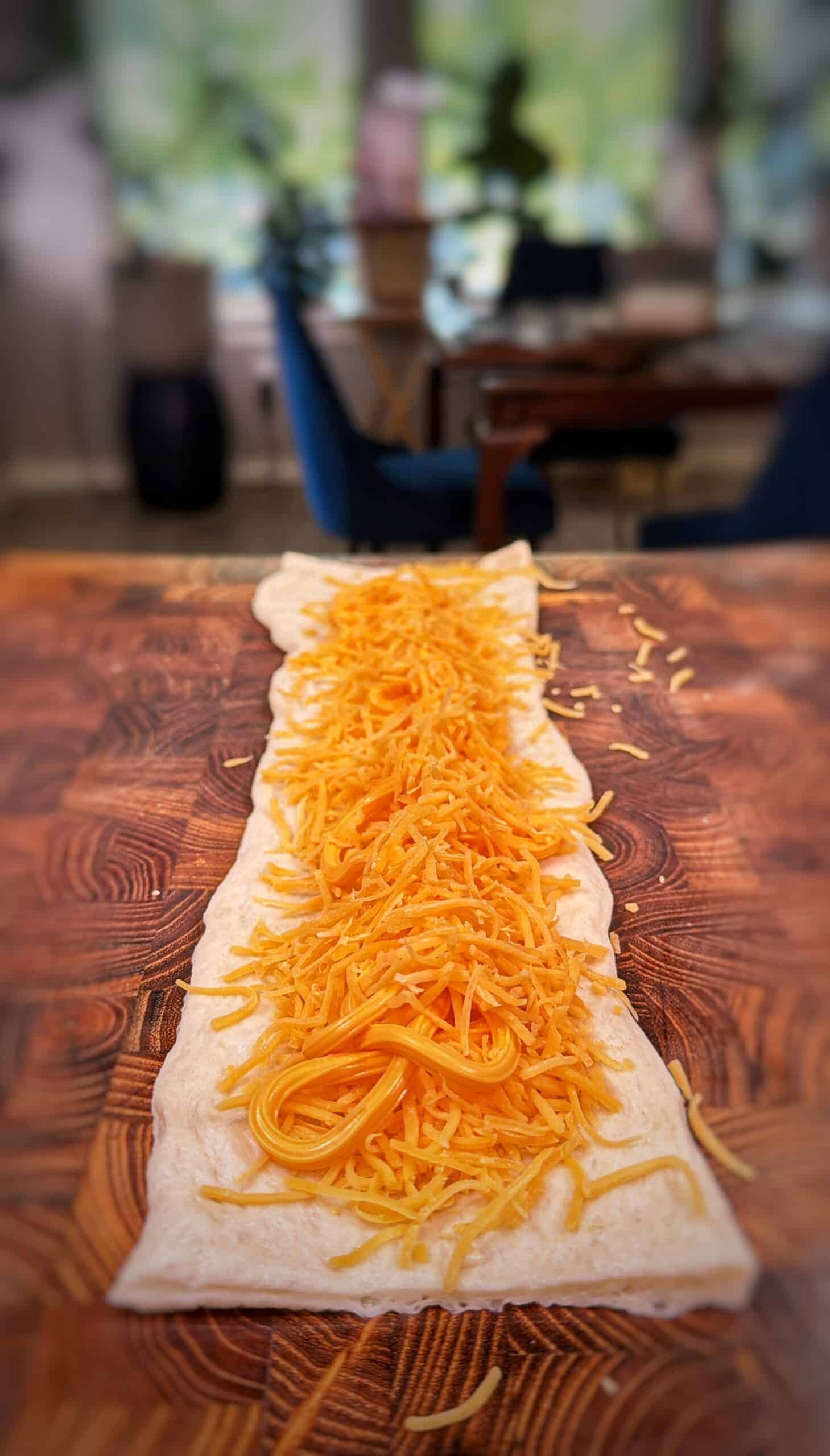 Cheddar cheese stuffed pretzels being prepared.