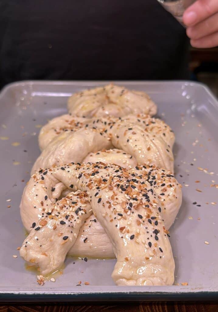 Cheddar cheese stuffed pretzels being prepared.