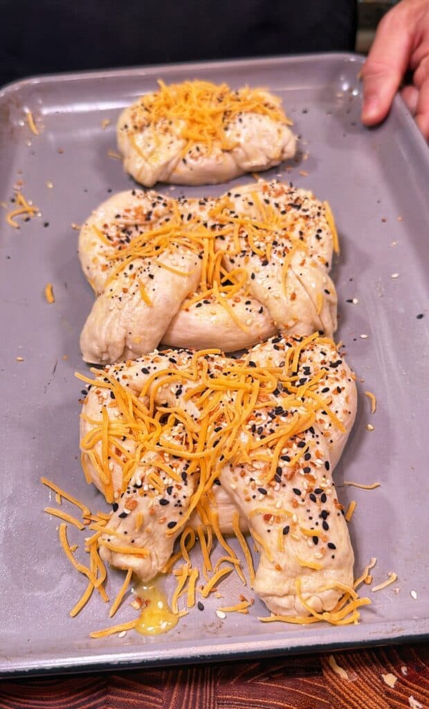 Cheddar cheese stuffed pretzels being prepared.