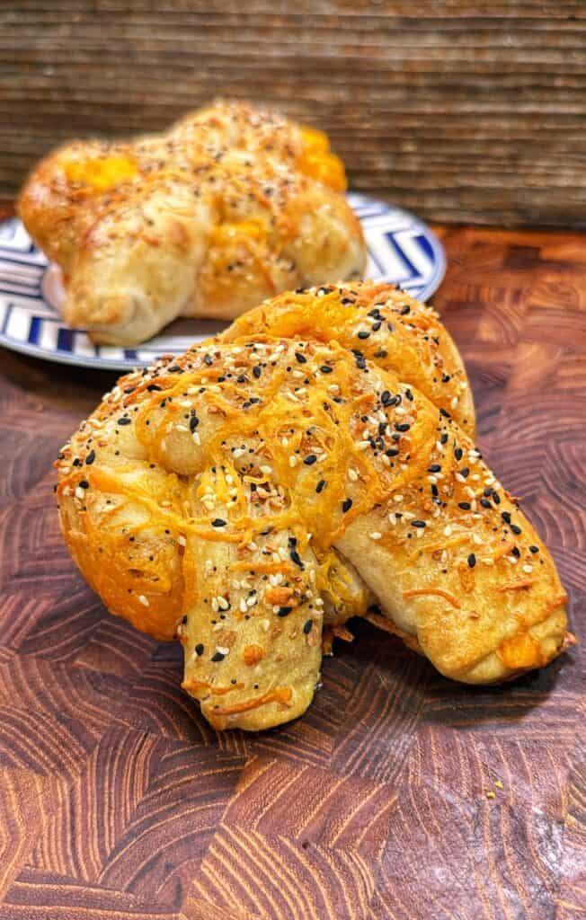 Cheddar cheese stuffed pretzels being prepared.